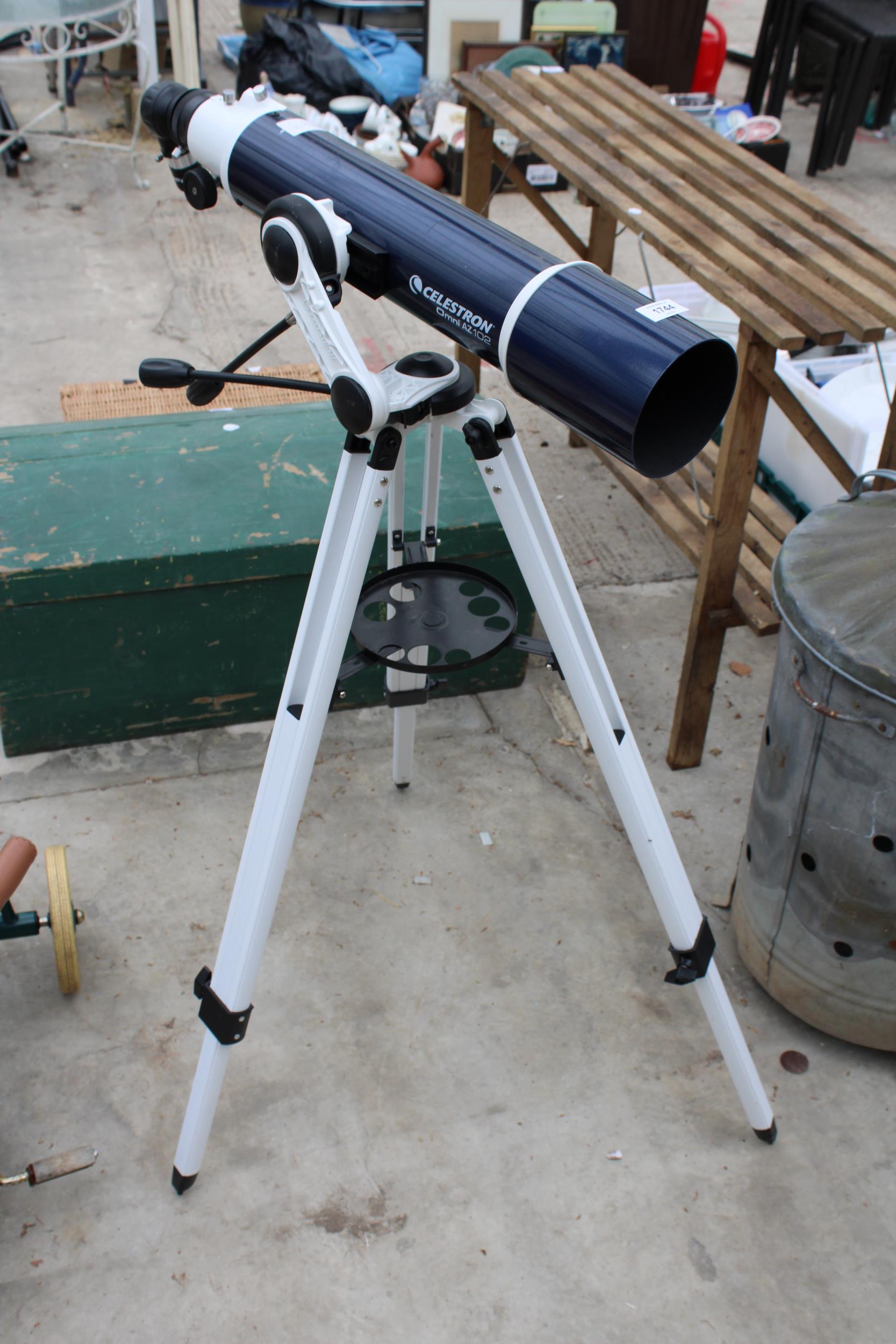 A CELESTRON OMNI AZ102 TELESCOPE WITH TRIPOD STAND