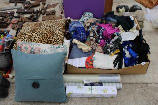 A LARGE ASSORTMENT OF CLOTHES, MATERIAL, BAGS AND CUSHIONS ETC