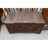 A HEAVILY CARVED CAMPHOR WOOD BLANKET CHEST, 40" WIDE
