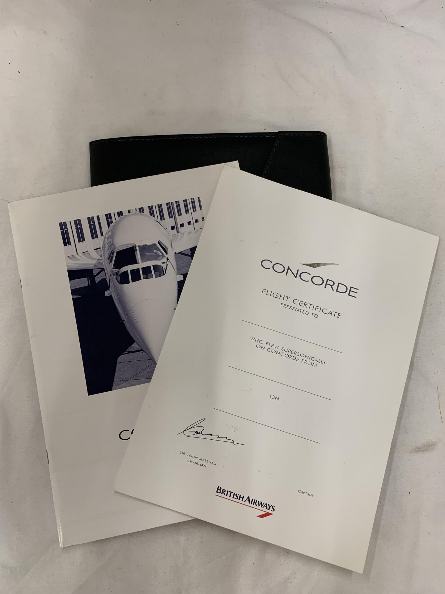 A FOLDER CONTAINING CONCORDE ITEMS