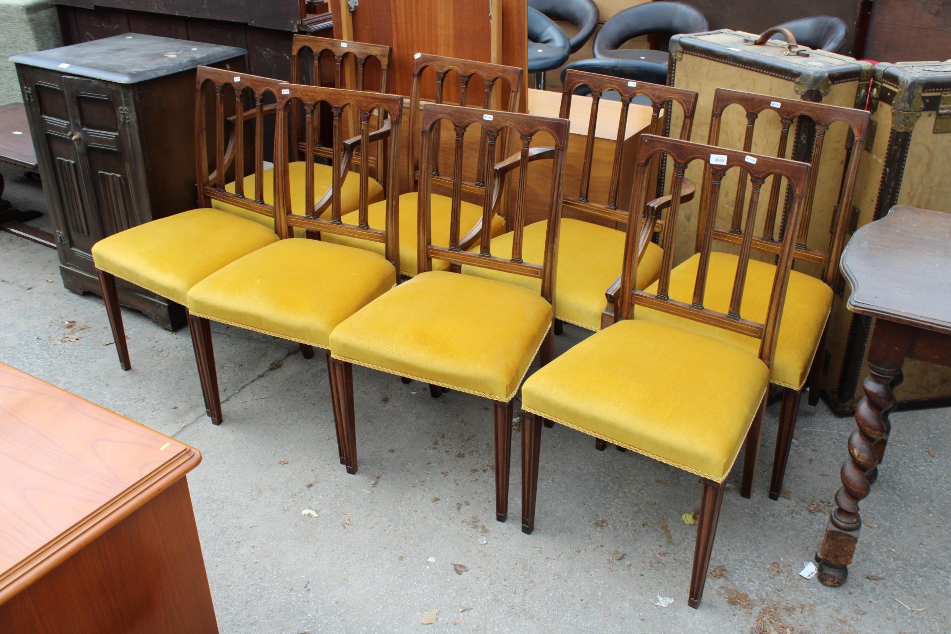 A SET OF EIGHT MAHOGANY AND INLAID REGENCY STYLE DINING CHAIRS, TWO BEING CARVERS ON TAPERING