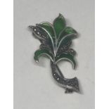 A SILVER, MARCASITE AND GREEN GLASS FLOWER BROOCH