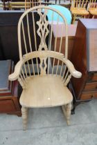 A WINDSOR STYLE ROCKING CHAIR