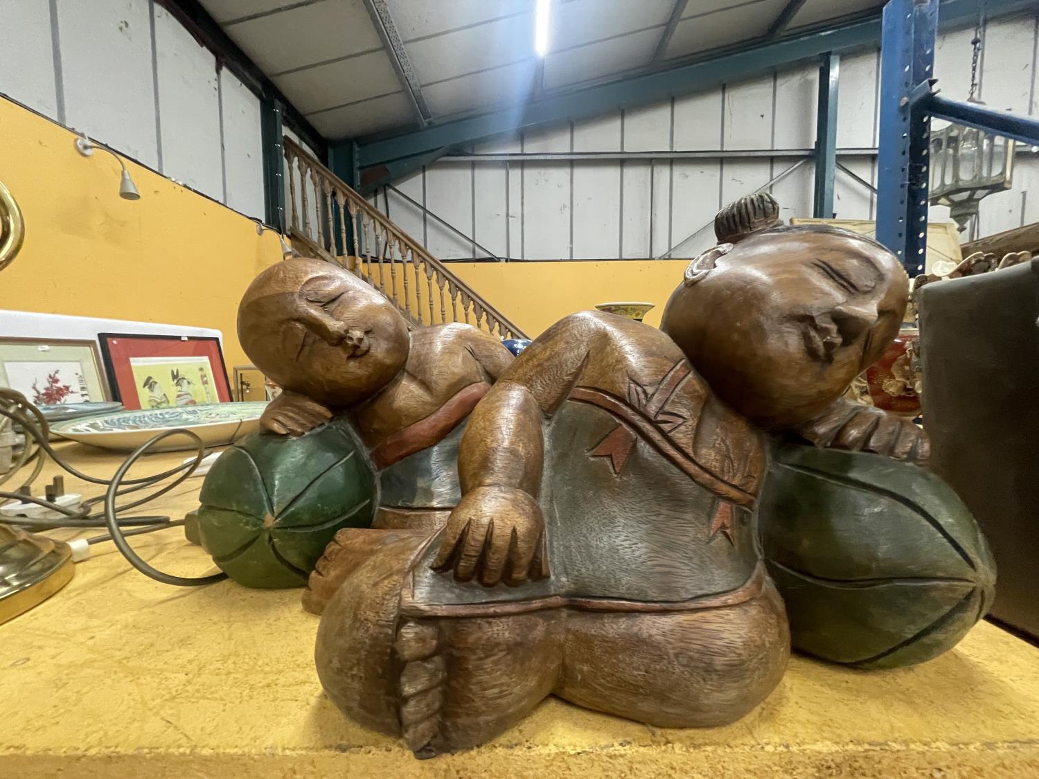 TWO LARGE CARVED HARDWOOD ORIENTAL FIGURES OF A SLEEPING BOY AND GIRL APPROXIMATELY 22CM TALL - Image 2 of 6