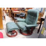 A STRESSLESS EKORNES RECLINING SWIVEL CHAIR AND STOOL