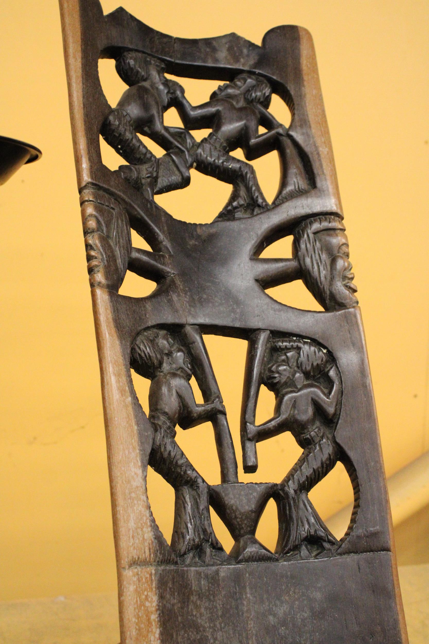 A VERY HEAVY CARVED AFRICAN BIRTHING CHAIR -APPROXIMATELY 91M - Image 2 of 3