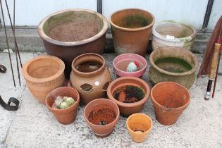 AN ASSORTMENT OF PLANT POTS TO INCLUDE TERRACOTTA EXAMPLES AND A STRAWBERRY POT ETC