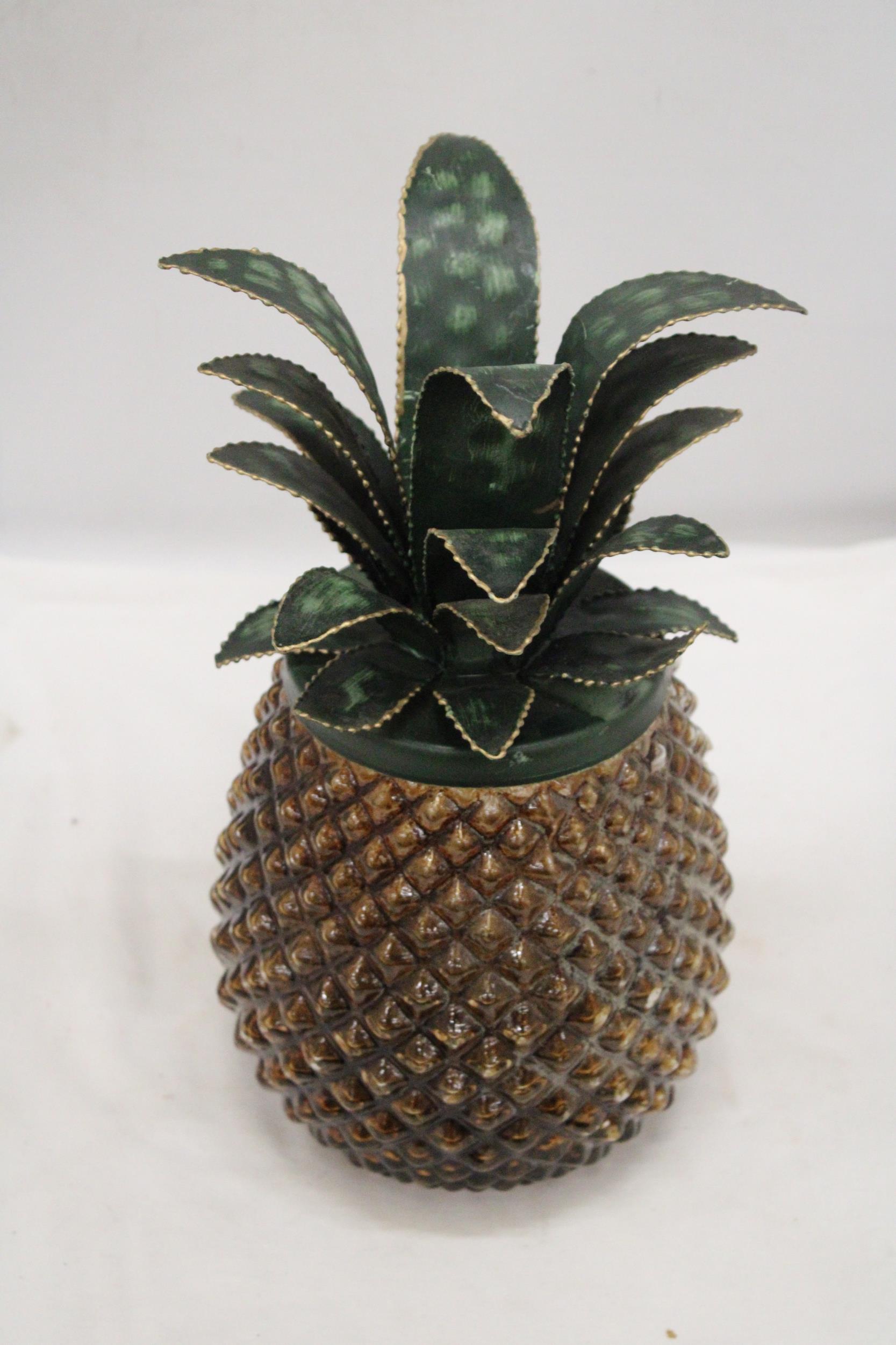 A 1960'S, CHUNKY GLASS ICE BUCKET WITH METAL PINEAPPLE LEAVES, HEIGHT 32CM