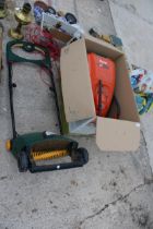A FLYMO POWER COMPACT 330 LAWN MOWER AND AN ELECTRIC LAWN RAKE