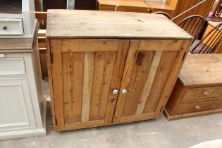 A VICTORIAN PINE TWO DOOR STORAGE CUPBOARD WITH PORCELAIN KNOBS, 42" WIDE