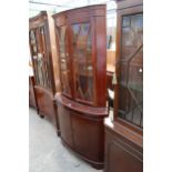 A MODERN MAHOGANY BOW FRONTED CORNER CUPBOARD WITH ORIGINAL RECEIPT £440 (2003)