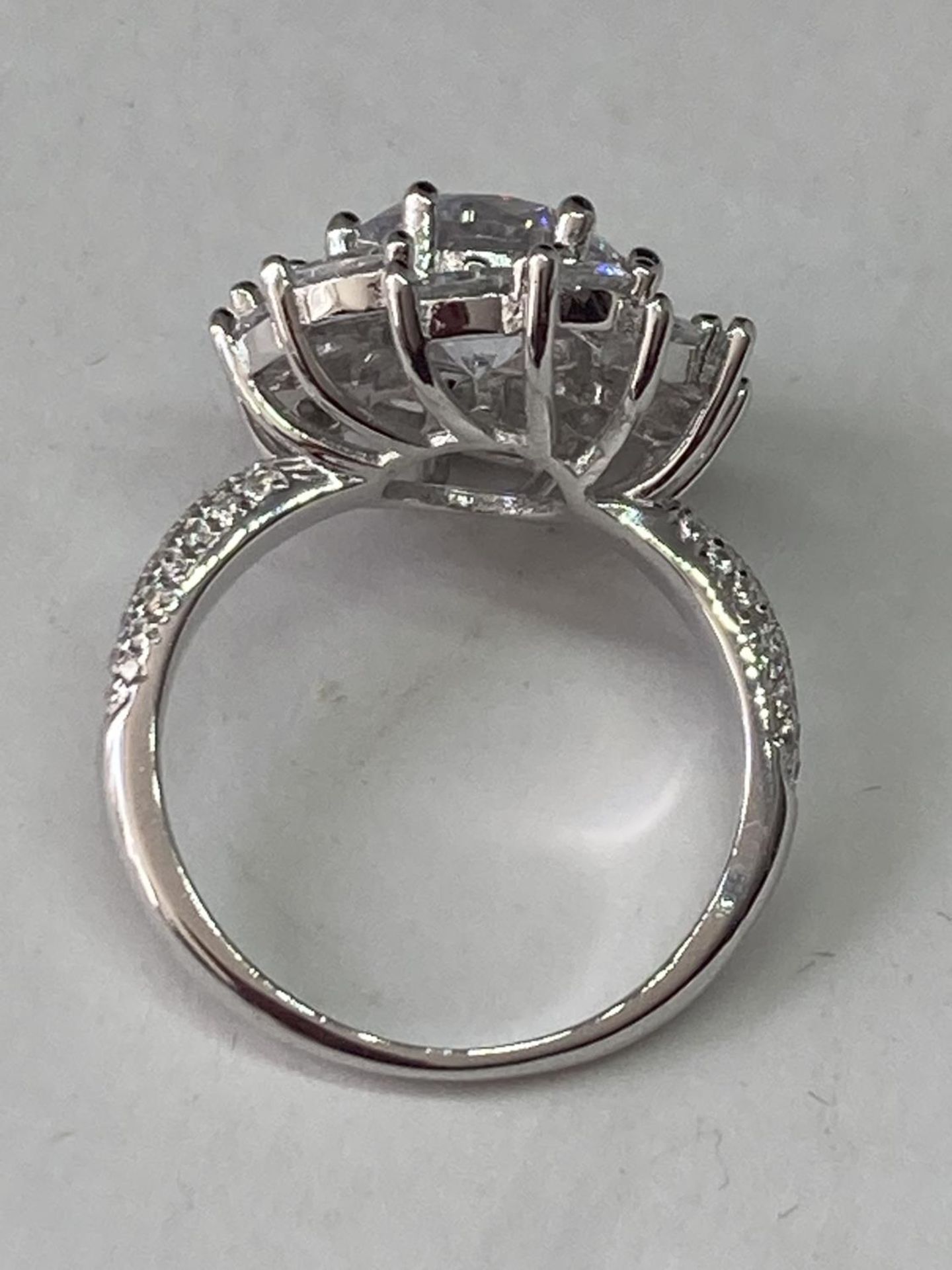 A WHITE METAL RING WITH 3 CARATS OF MOISSANITE IN A CLUSTER DESIGN SIZE Q - Image 6 of 6