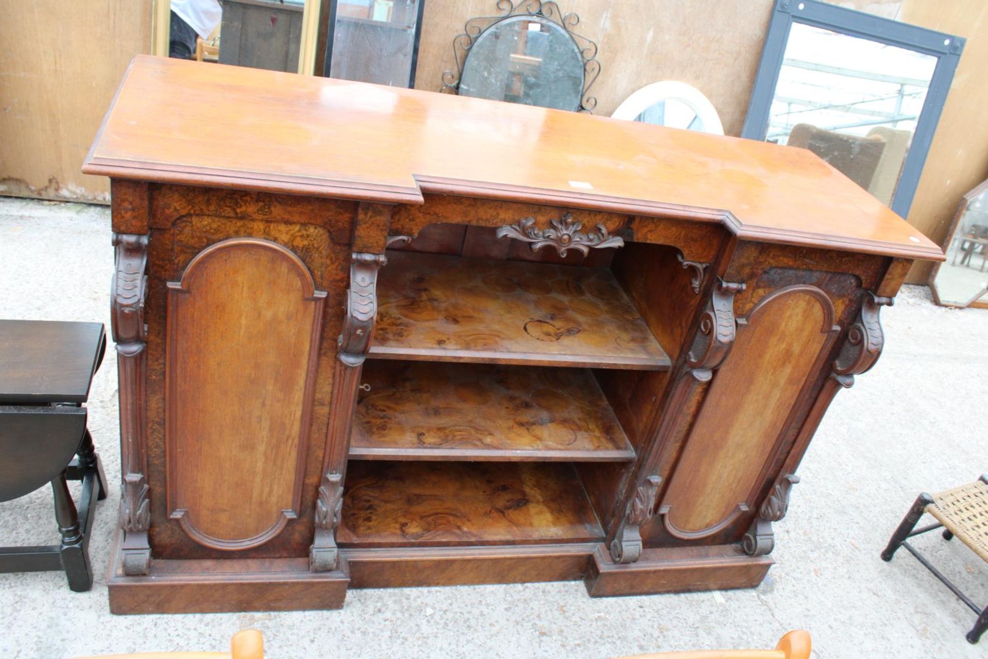 A VICTORIAN MAHOGANY AND WALNUT BREAKFRONT SIDEBOARD ENCLOSING TWO CUPBOARDS 59" WIDE