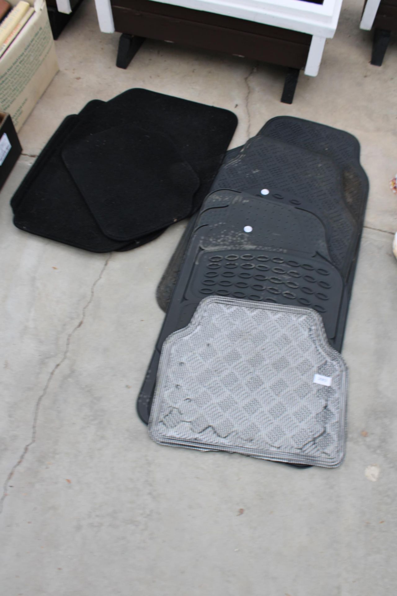 AN ASSORTMENT OF VARIOUS RUBBER AND CARPET CAR MATS