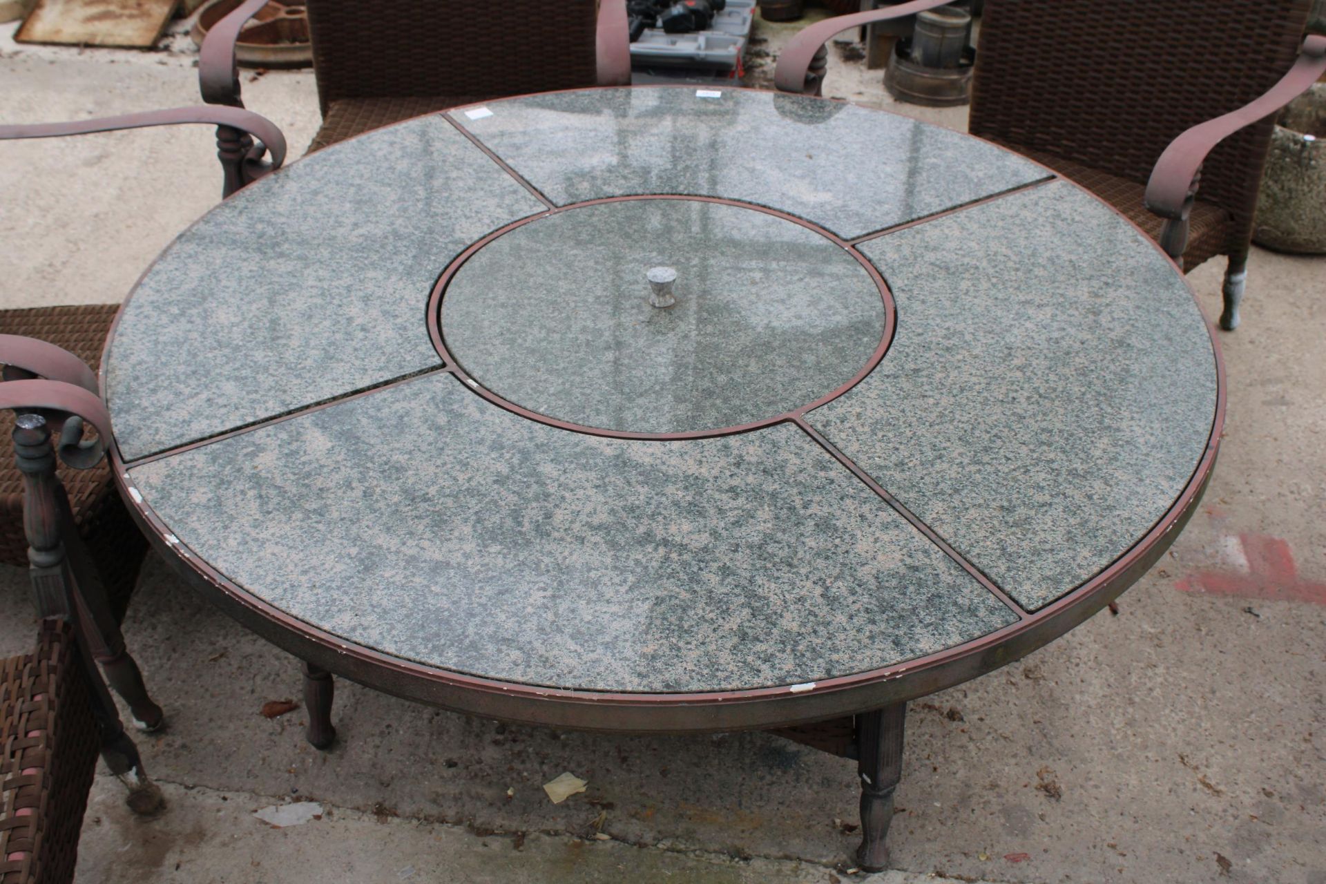 A GARDEN FURNITURE SET COMPRISING OF FOUR RATTAN CHAIRS AND A GRANITE TOP TABLE WITH FIRE PIT CENTRE - Image 3 of 4