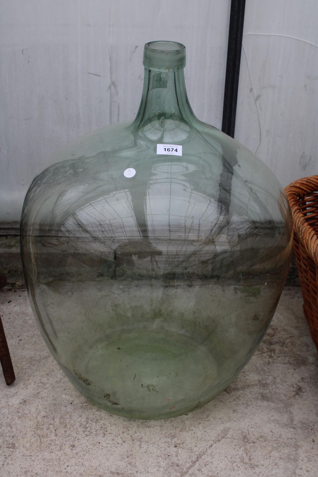 A LARGE VINTAGE GLASS CARBOY