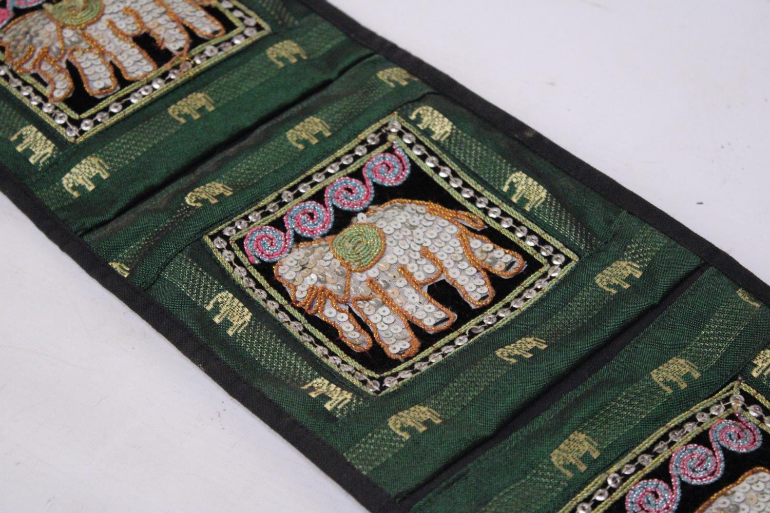 A VINTAGE THAI FABRIC WALL HANGING THREE POCKET ORGANIZER WITH ELEPHANT DECORATION - Image 2 of 4