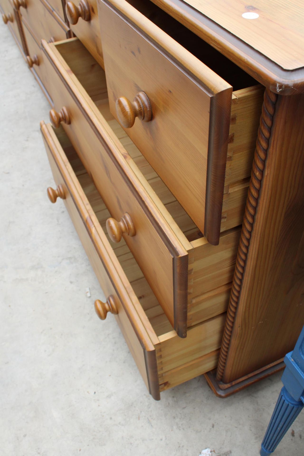 A MODERN PINE CHEST OF FOUR SHORT AND FOUR LONG DRAWERS, 66" WIDE - Image 3 of 4