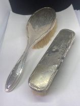 TWO HALLMARKED SILVER BRUSHES TO INCLUDE A HAIRBRUSH AND CLOTHES BRUSH