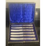 A SET OF SIX HALLMARKED SHEFFIELD SILVER HANDLED BUTTER KNIVES IN A PRESENTATION BOX