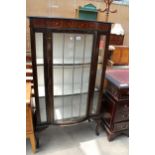 AN EDWARDIAN MAHOGANY AND INLAID BOW-FRONTED GLAZED AND LEADED DISPLAY CABINET ON CABRIOLE LEGS, 30"