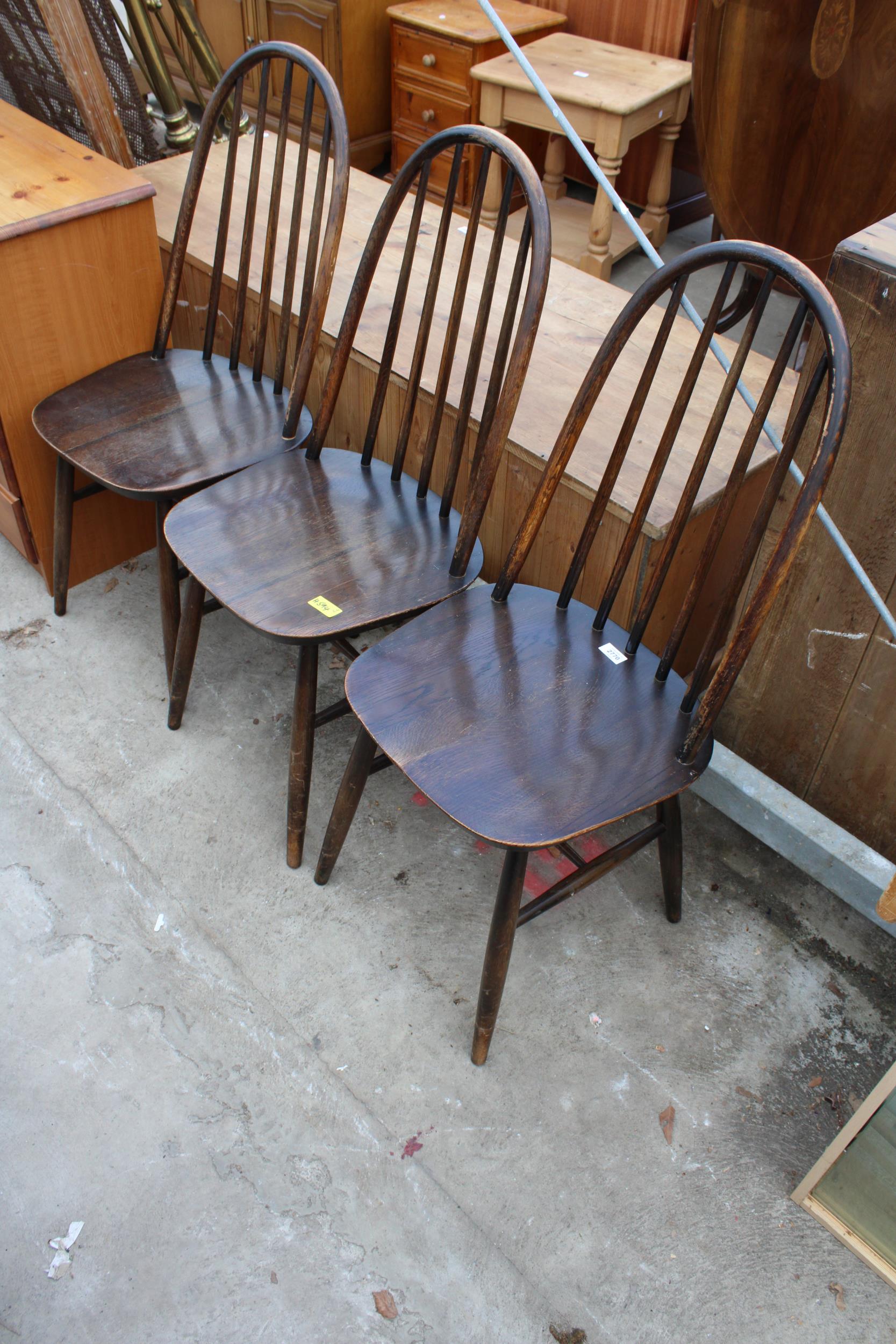 THREE ERCOL STYLE ELM AND BEECH DINING CHAIRS