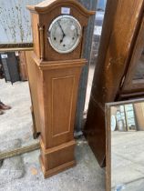 A WESTMINSTER CHIMING GRANDMOTHER CLOCK WITH ENGLISH MOVEMENT