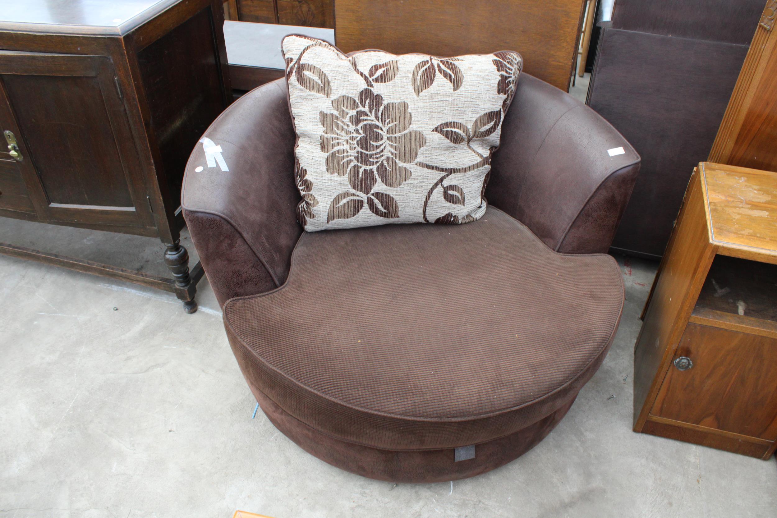 A BROWN LAURA ASHLEY SWIVEL SNUGGLE CHAIR