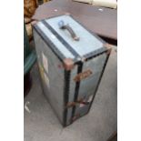 AN EARLY 20TH CENTURY COMPRESSED FIBRE TRAVEL TRUNK