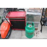 A SUPERSER GAS HEATER WITH GAS BOTTLE AND A METAL FOUR WHEELED WORKSHOP TOOL CHEST