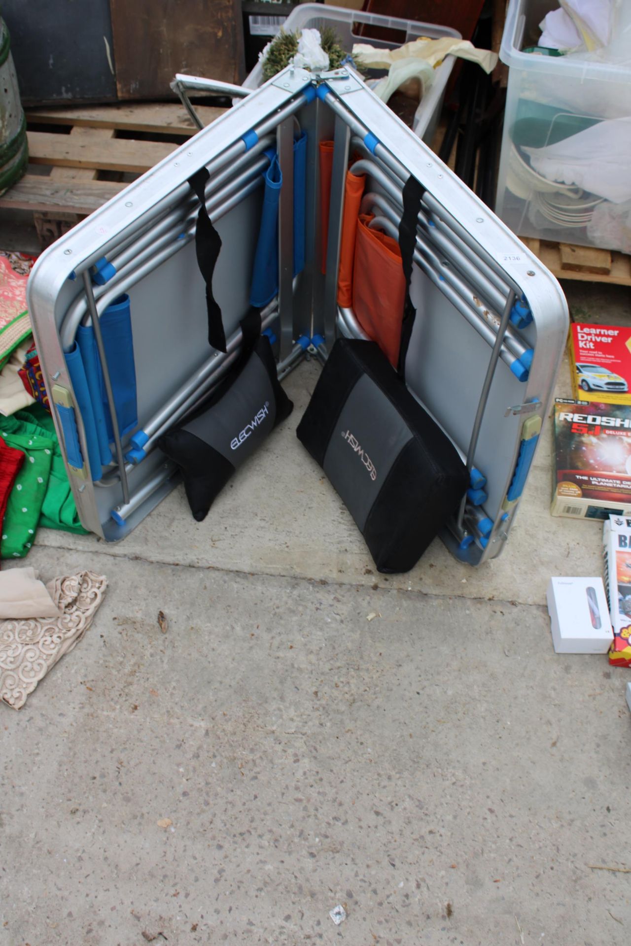 A FOLDING CAMPING TABLE WITH TWO STOOLS