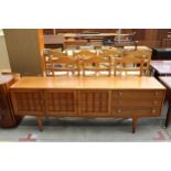 A RETRO TEAK YOUNGER SIDEBOARD ENCLOSING THREE CUPBOARDS, THREE DRAWERS, 81" WIDE