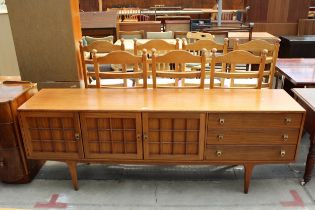 A RETRO TEAK YOUNGER SIDEBOARD ENCLOSING THREE CUPBOARDS, THREE DRAWERS, 81" WIDE