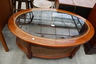 A MODERN OVAL COFFEE TABLE WITH INSET GLASS TOP AND SPLIT CANE UNDER TIER, 42" X 28"