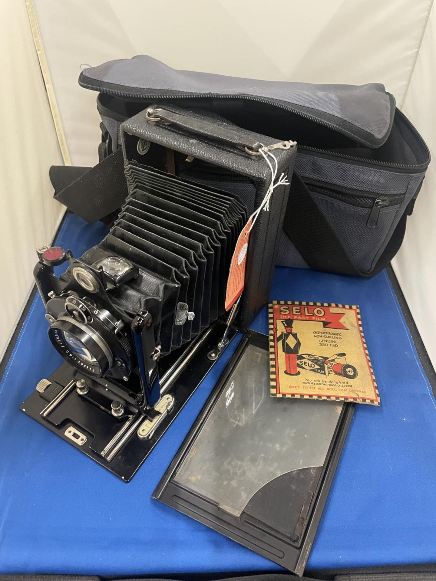 A GERMAN CIRCA 1925 FOLDING CAMERA MADE BY ZEH WITH PLATES ETC