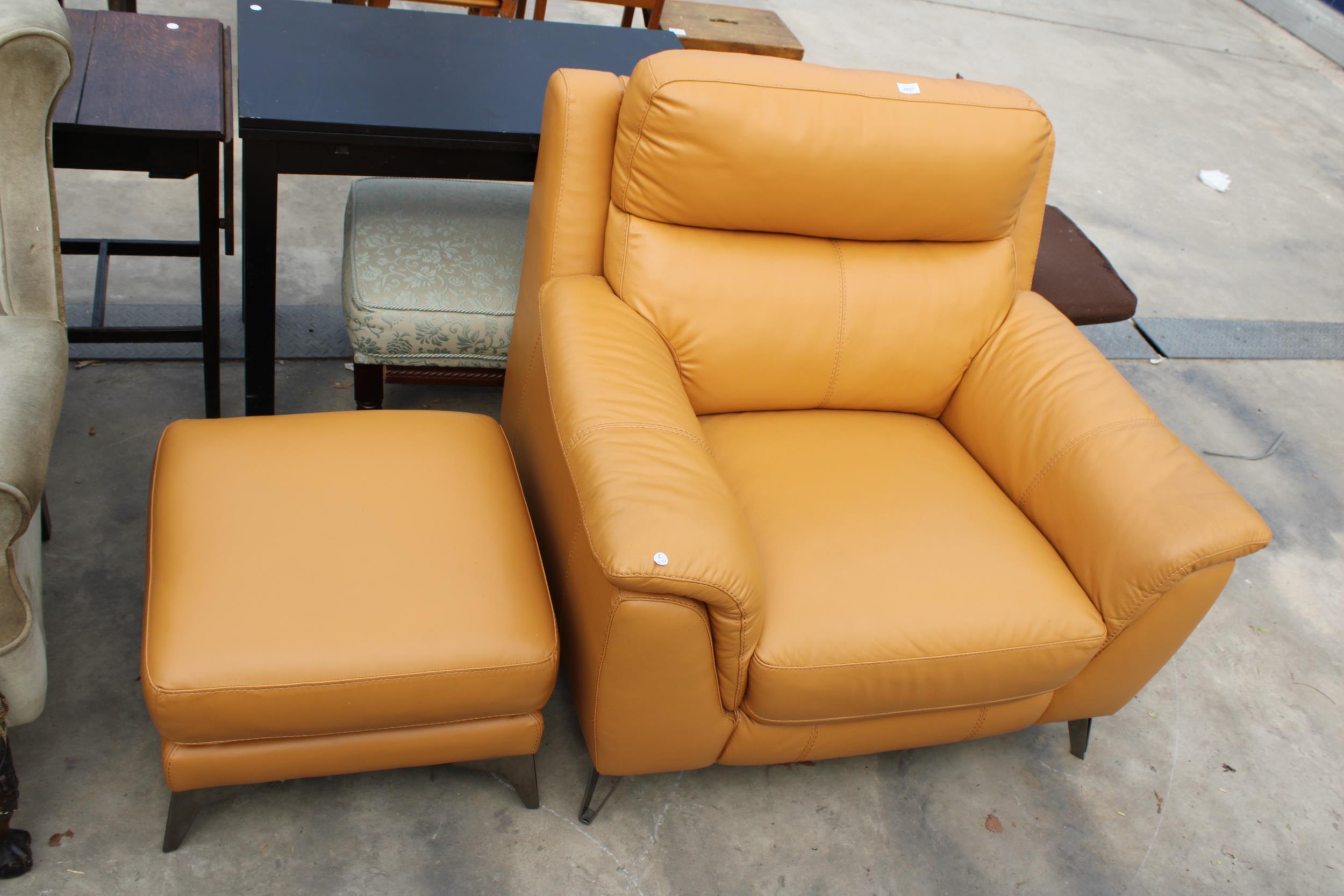 A CARAMEL LEATHER EASY CHAIR AND FOOTSTOOL ON POLISHED CHROME LEGS