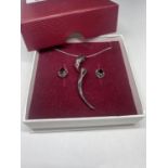 A SILVER NECKLACE AND EARRINGS SET IN A PRESENTATION BOX