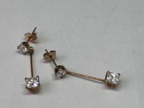 A PAIR OF 9 CARAT GOLD AND CLEAR STONE DROP EARRINGS
