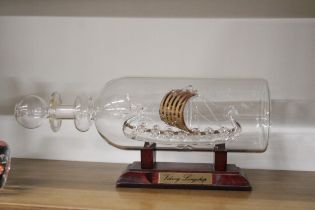 A GLASS MODEL OF A VIKING LONGSHIP IN A BOTTLE