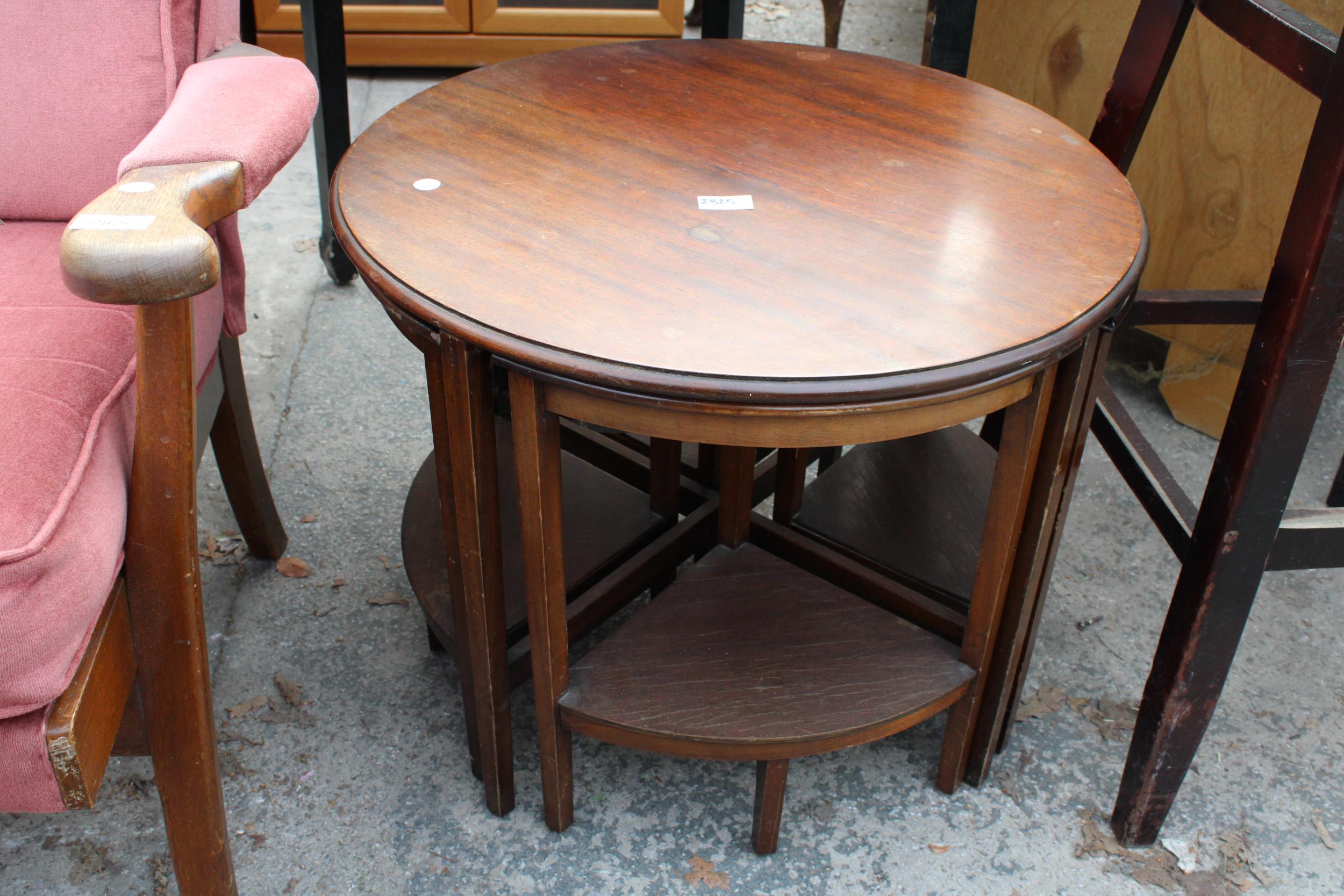 A MID 20TH CENTURY 23.5" DIAMETER NEST OF FIVE TABLES