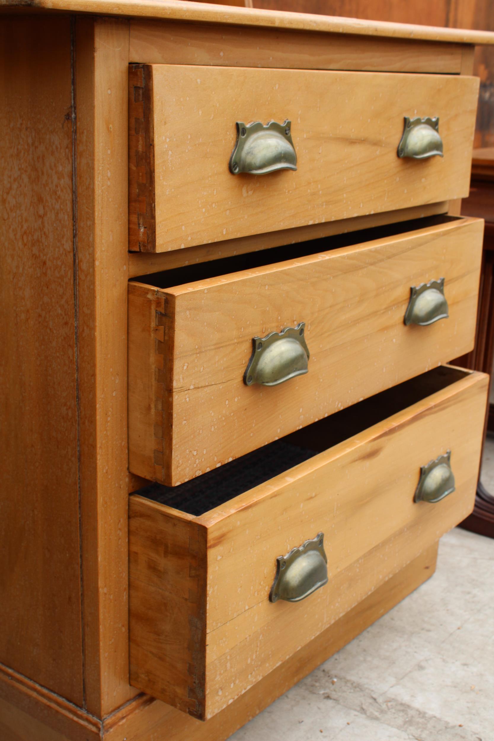 A VICTORIAN SATINWOOD DRESSING CHEST WITH THREE DRAWERS HAVING BRASS SCOOP HANDLES, 33" WIDE - Image 3 of 3