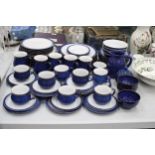 A DENBY COBALT BLUE DINNER SERVICE TO INCLUDE VARIOUS SIZES OF PLATES, BOWLS, A LARGE JUG, SUGAR