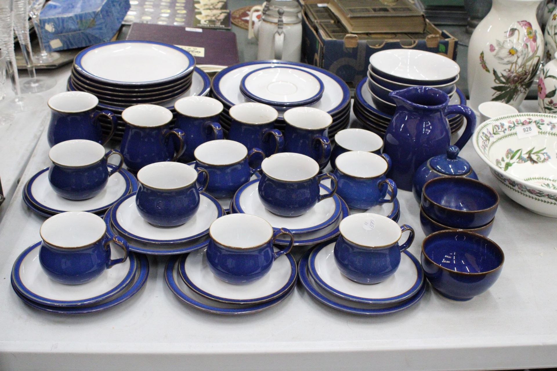 A DENBY COBALT BLUE DINNER SERVICE TO INCLUDE VARIOUS SIZES OF PLATES, BOWLS, A LARGE JUG, SUGAR
