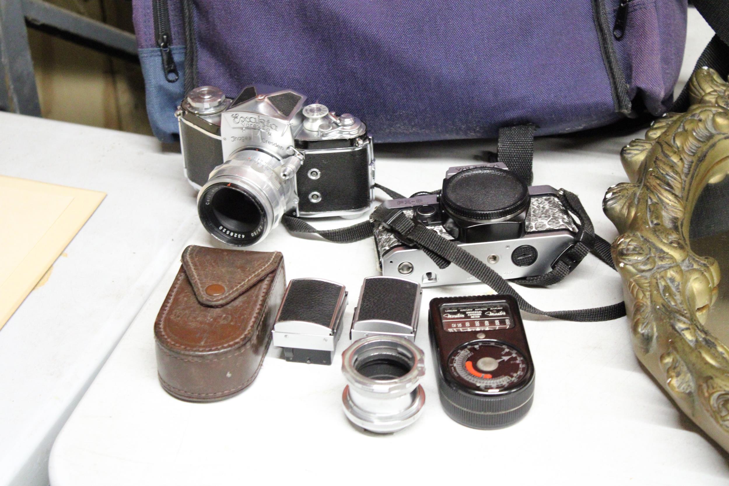 A YASHIKA FX-D QUARTZ CAMERA, EXAKTA VAREX CAMERA, LIGHT METER, ETC PLUS A CAMERA BAG