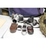 A YASHIKA FX-D QUARTZ CAMERA, EXAKTA VAREX CAMERA, LIGHT METER, ETC PLUS A CAMERA BAG