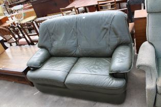 A MODERN GREEN LEATHER TWO SEATER SETTEE