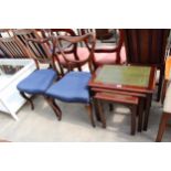 A NEST OF THREE MAHOGANY TABLES WITH INSET LEATHER TOPS AND A PAIR OF VICTORIAN PARLOUR CHAIRS