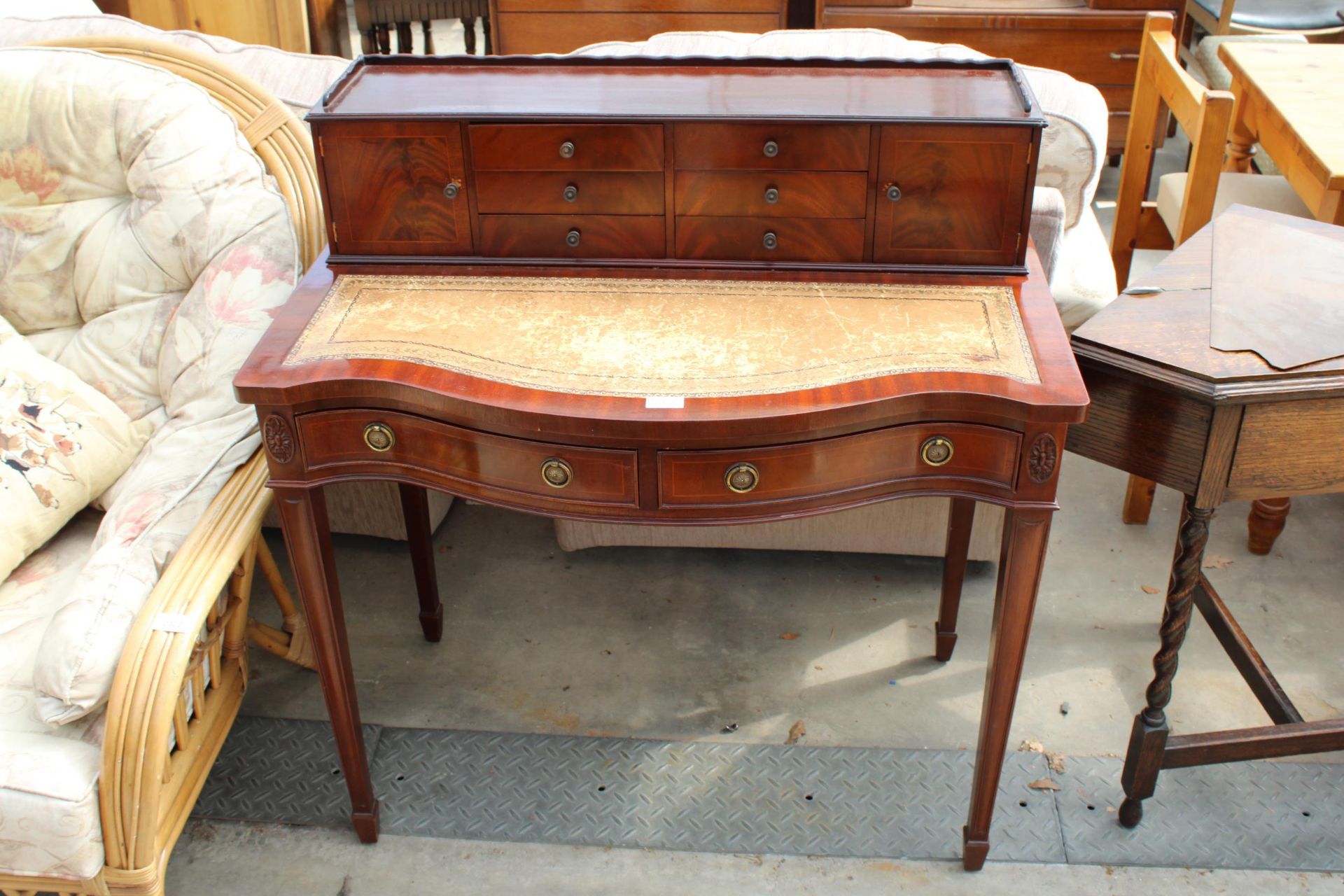 A 19TH CENTURY STYLE LADIES SERPENTINE FRONT LADIES WRITING DESK WITH INSET LEATHER TOP, 36" WIDE