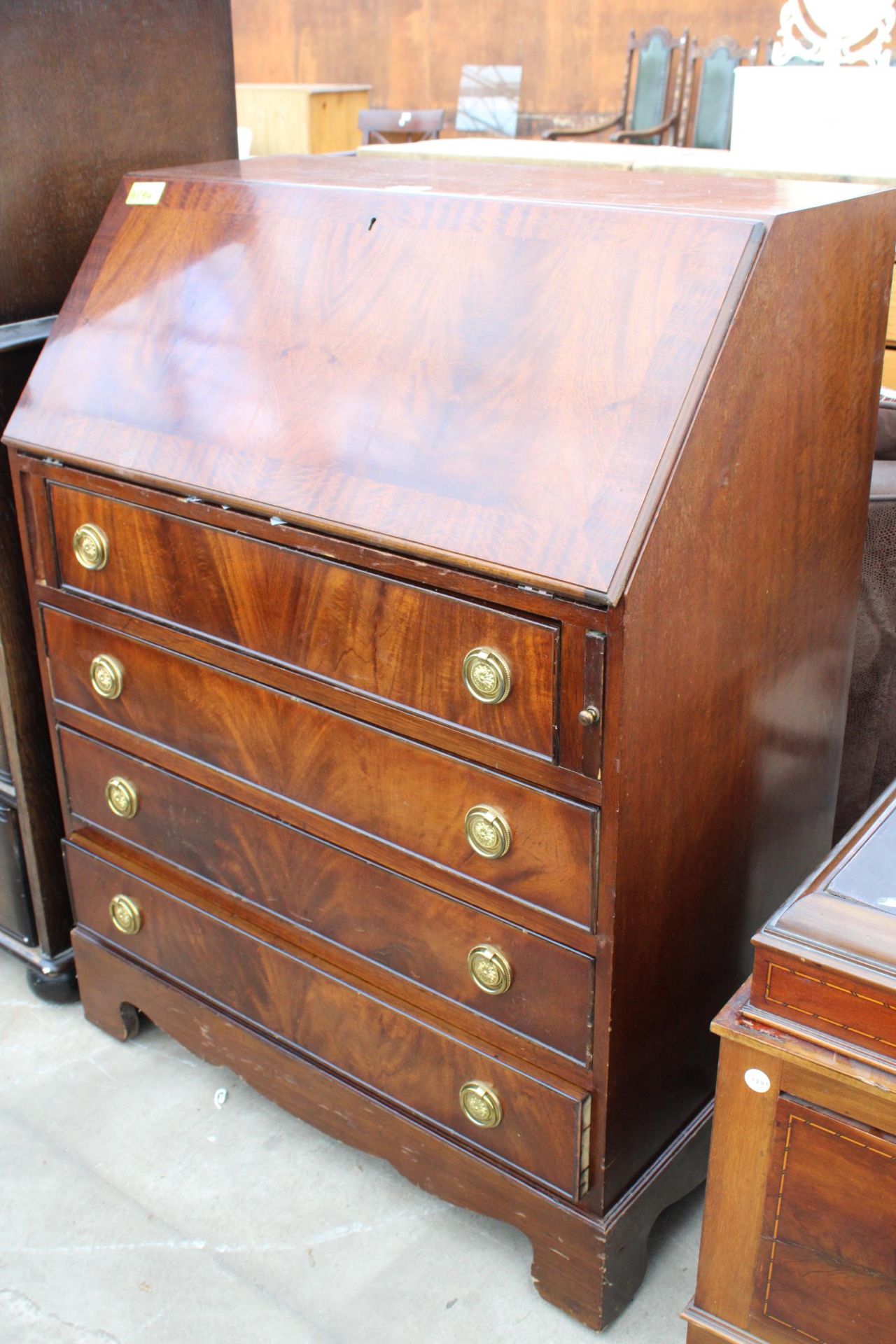 A REPRPDUCTION MAHOGANY AND CROSSBANDED BUREAU, 29.5" WIDE - Image 2 of 4