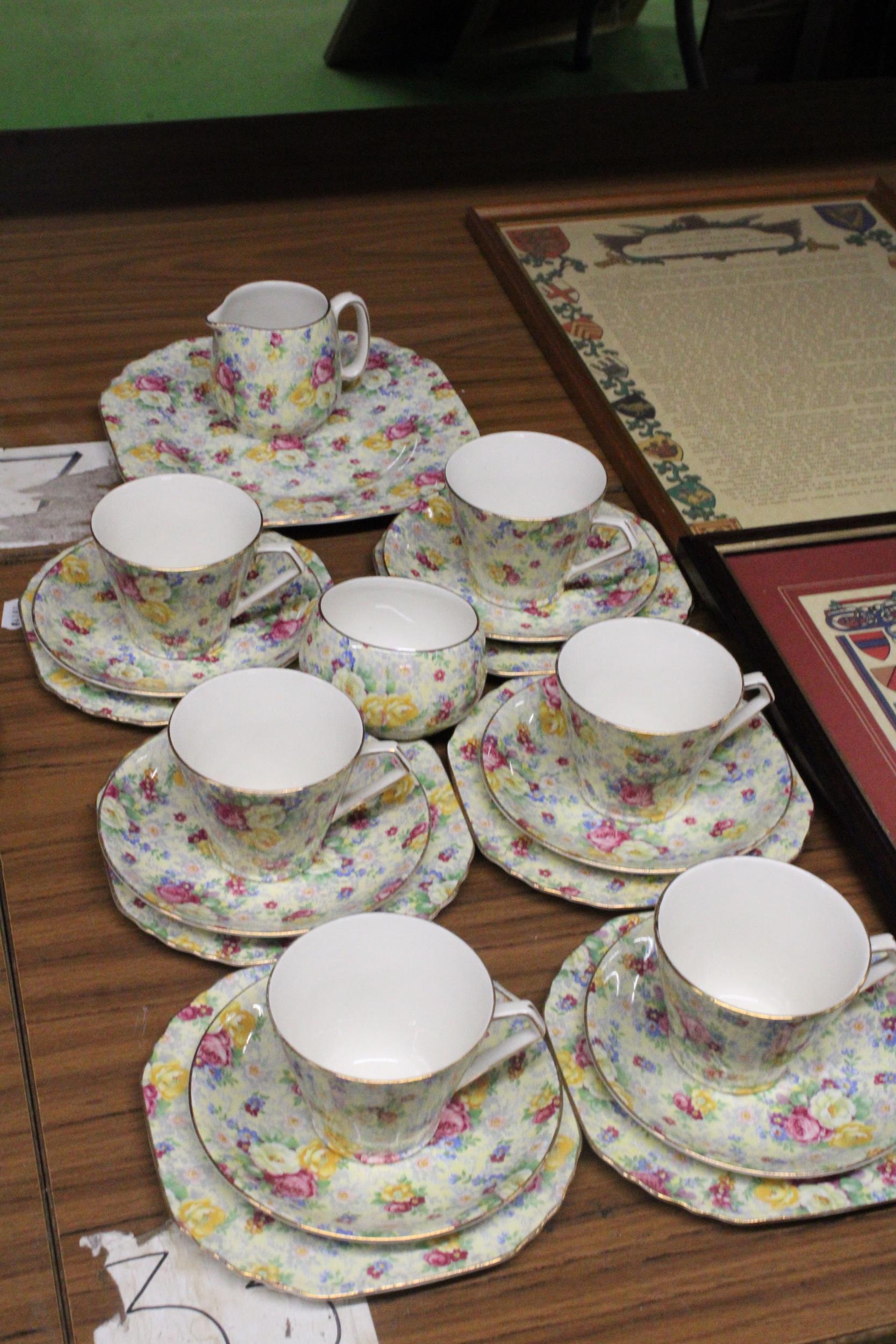 A LORD NELSON CHINTZ TEASET TO INCLUDE A CAKE PLATE, CREAM JUG, SUGAR BOWL, CUPS, SAUCERS AND SIDE